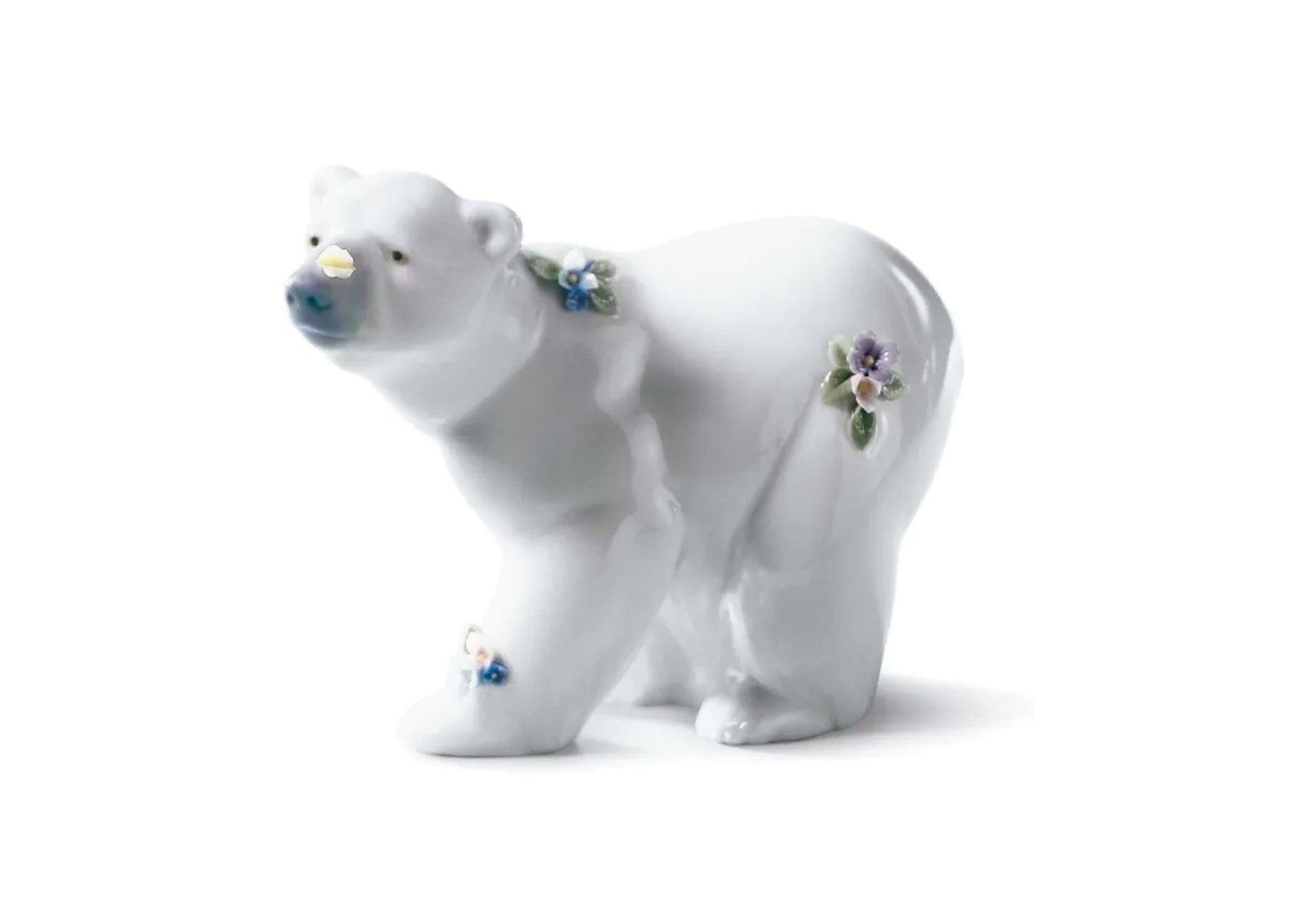 Attentive polar bear with flowers